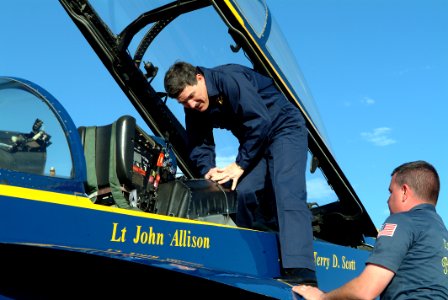US Navy 050203-N-0962S-170 Master Chief Petty Officer of the Navy (MCPON) Terry Scott climbs from the back seat after taking a flight in an F-A-18D Hornet while visiting the Blue Angels' winter training facility on board Naval