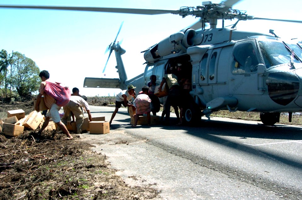 US Navy 050116-N-4142G-004 An MH-60S Knighthawk from Helicopter Combat Support Squadron Eleven (HC-11) delivers aid to areas of Indonesia
