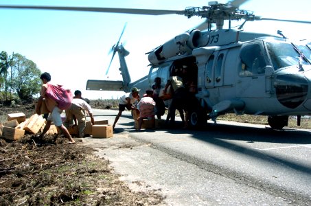US Navy 050116-N-4142G-004 An MH-60S Knighthawk from Helicopter Combat Support Squadron Eleven (HC-11) delivers aid to areas of Indonesia