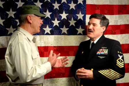 US Navy 050211-N-0962S-003 Master Chief Petty Officer of the Navy (MCPON) Terry Scott speaks to R. Lee Ermey in the Navy Operations Center at the Pentagon photo