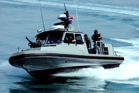US Navy 050303-N-0000X-002 Sailors assigned to Inshore Boat Unit Two Four (IBU-24) conduct a security patrol in the waters near Kuwait Naval Base photo
