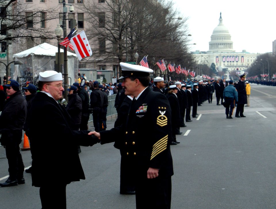 US Navy 050120-N-0962S-044 Master Chief Petty Officer of the Navy (MCPON) Terry Scott shakes hands with one of the hundreds of Sailors who helped line the street cordon down Pennsylvania Avenue for the Inauguration Day Parade