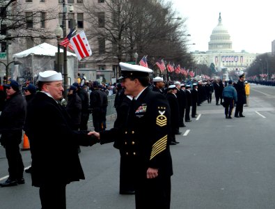 US Navy 050120-N-0962S-044 Master Chief Petty Officer of the Navy (MCPON) Terry Scott shakes hands with one of the hundreds of Sailors who helped line the street cordon down Pennsylvania Avenue for the Inauguration Day Parade