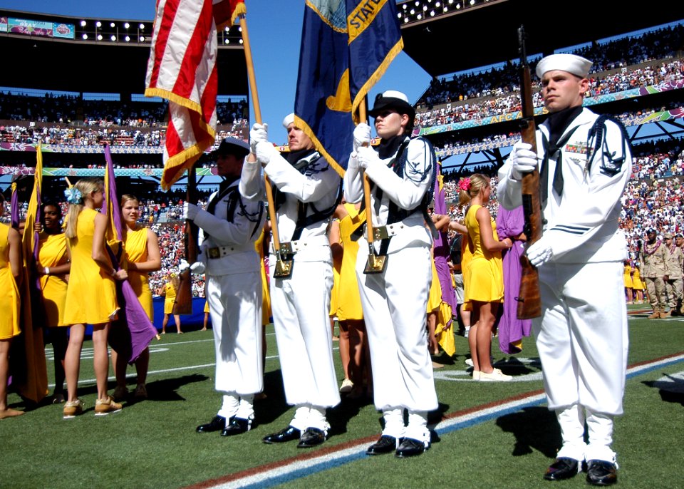 US Navy 050213-N-3019M-006 A Naval Station Pearl Harbor, Hawaii ceremonial color guard parades the colors during the playing of the National Anthem at the 2005 NFL Pro Bowl, held in Honolulu, Hawaii