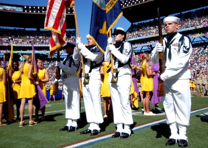 US Navy 050213-N-3019M-006 A Naval Station Pearl Harbor, Hawaii ceremonial color guard parades the colors during the playing of the National Anthem at the 2005 NFL Pro Bowl, held in Honolulu, Hawaii
