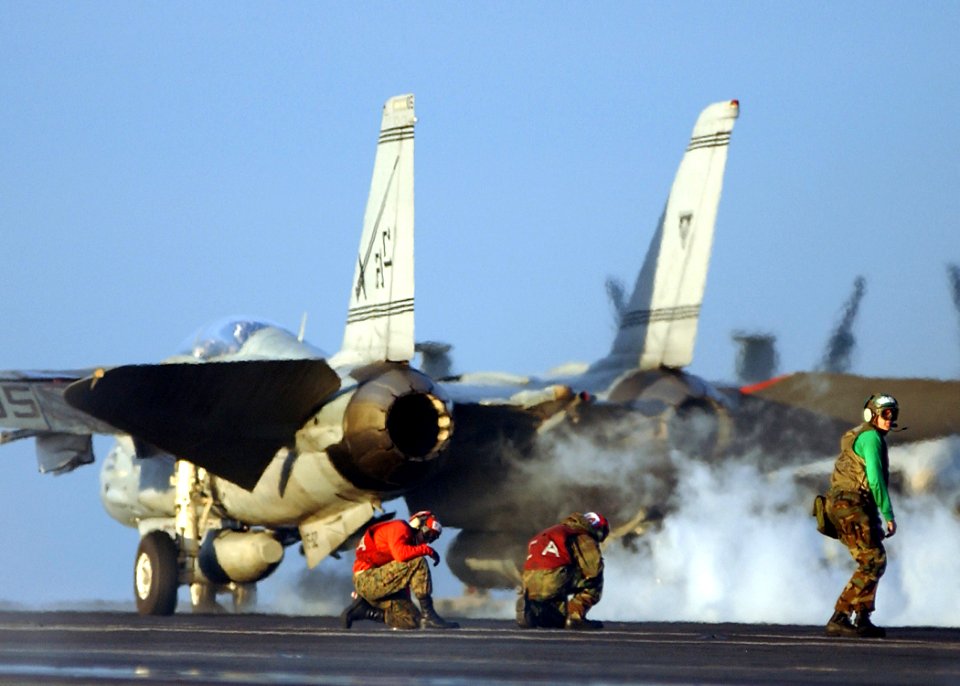 US Navy 050121-N-4308O-095 An F-14 Tomcat assigned to the Swordsmen of Fighter Squadron Three Two (VF-32 launches off one of four steam-powered catapult aboard the Nimitz-class aircraft carrier USS Harry S. Truman (CVN 75)