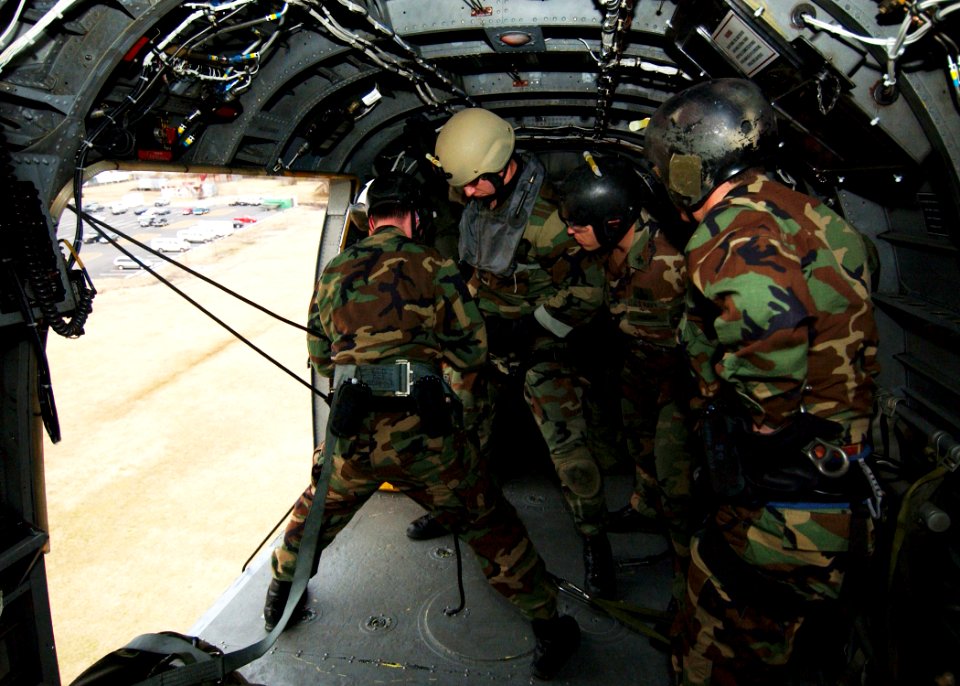 US Navy 050216-N-4374S-002 Sailors assigned to Explosive Ordnance Disposal Mobile Unit Two (EODMU-2), prepare to repel out of a UH-3H Sea King helicopter