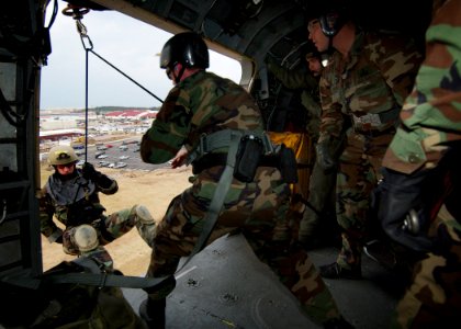 US Navy 050216-N-4374S-003 A Sailor assigned to Explosive Ordnance Disposal Mobile Unit Two (EODMU-2), rappels out of a UH-3H Sea King helicopter