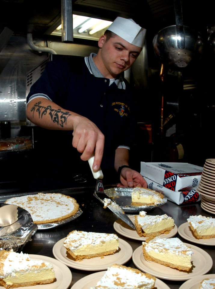 US Navy 050217-N-3390M-015 Quartermaster 3rd Class Derek Declue prepares lemon pie to be served aboard the guided missile frigate USS Rodney M. Davis (FFG 60)