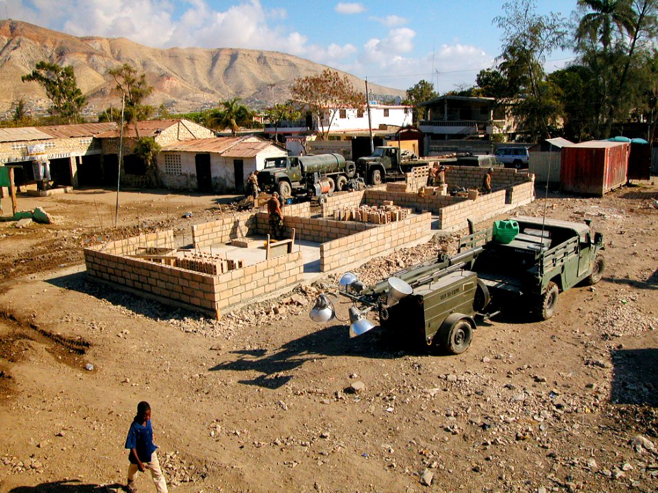 US Navy 050310-N-1464F-013 U.S. Navy Seabees assigned to Naval Mobile Construction Battalion One (NMCB-1), construct a new school for students in Gonaives, Haiti
