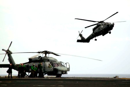 US Navy 050127-N-6074Y-202 An SH-60B Seahawk helicopter, assigned to the Saberhawks of Helicopter Anti-Submarine Light Squadron Four Seven (HSL-47) refuels on the flight deck of USS Abraham Lincoln (CVN-72)
