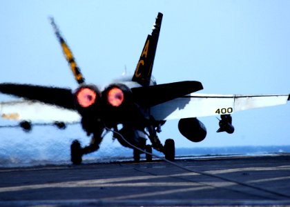 US Navy 050212-N-6363M-050 An F-A-18C Hornet lands on the flight deck aboard the Nimitz-class aircraft carrier USS Harry S. Truman (CVN 75)