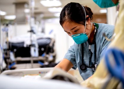 USNS Mercy Sailor Treats Patient (49786022002)