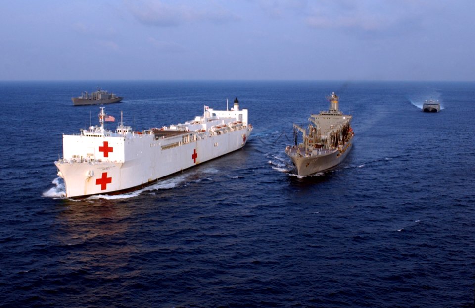 US Navy 050303-N-8796S-075 The Military Sealift Command (MSC) hospital ship USNS Mercy (T-AH 19) receives fuel from the MSC underway replenishment oiler USNS Tippecanoe (T-AO 199) as USNS San Jose (T-AFS 7) and HSV-2 operate al