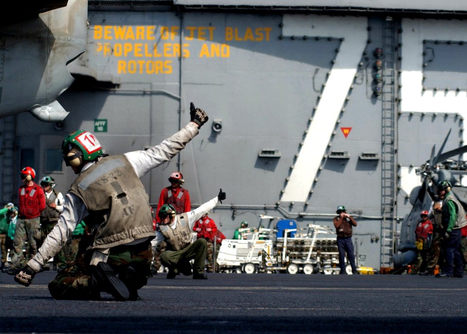US Navy 050316-N-6363M-013 Final checkers assigned to the Checkmates of Sea Control Squadron Two Two (VS-22) give a thumbs up for the launch of an S-3B Viking aboard USS Harry S. Truman (CVN 75)