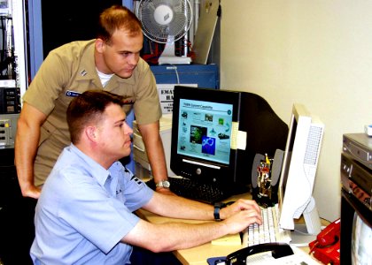 US Navy 050307-N-0879R-001 Lt. Andrew Neboshynsky and Operations Specialist 1st Class Troy Tyson monitor Anti-Submarine Warfare (ASW) activity in the Pacific using the Navy's Maui High Performance Computing Center (MHPCC)