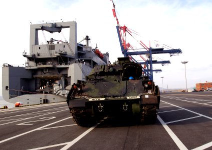 US Navy 050312-F-2902B-001 An M2A3 Bradley Fighting Vehicle is prepared for loading aboard the Military Sealift Command (MSC) roll-on-roll-off ship USNS Watson (T-AKR 310)