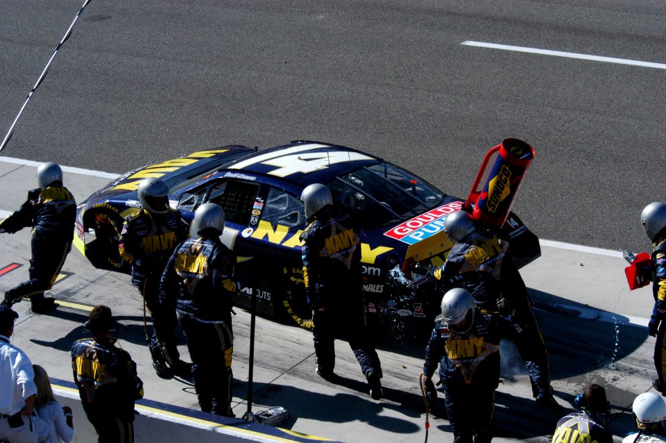 US Navy 050312-F-2575F-002 Team members of the FitzBradshaw NASCAR Busch Series Race Team works to get driver David Stremme off pit row