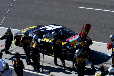 US Navy 050312-F-2575F-002 Team members of the FitzBradshaw NASCAR Busch Series Race Team works to get driver David Stremme off pit row