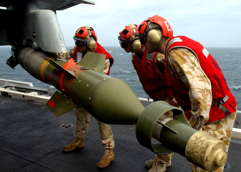 US Navy 050313-N-6363M-004 A U.S. Sailor assigned to Explosive Ordnance Disposal Mobile Unit Six (EODMU-6), Detachment 10, left, shows two members of the 49 FD Field Squadron (EOD) Royal Engineers form the United Kingdom, proc