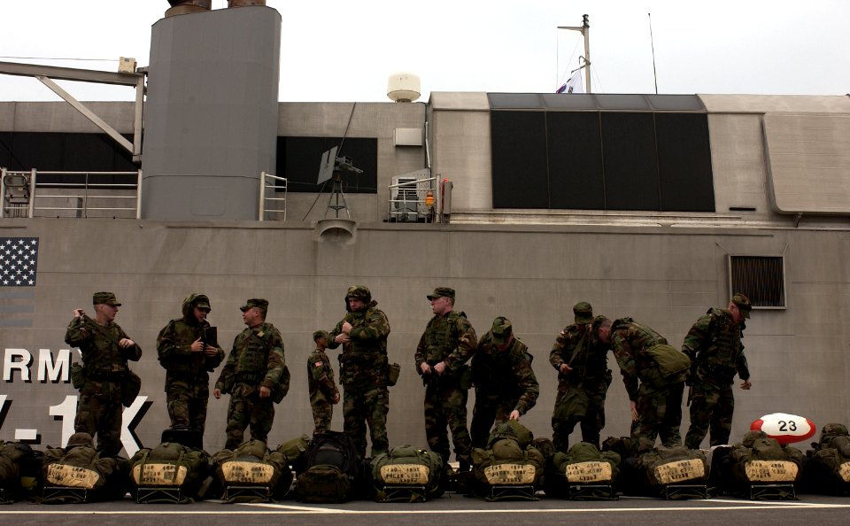 US Navy 050315-F-9629D-181 U.S. Army Soldiers assigned to C Troop, 1st Squadron, 1st U.S. Calvary Regiment, prepare to board the U.S. Army's Theater Support Vessel TSV-1X Spearhead