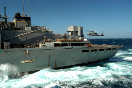 US Navy 050313-N-8704K-005 An SH-60B Seahawk delivers a pallet of ordnance to the Military Sealift Command (MSC) fast combat support ship USNS Supply (T-A0E 6) during a ammunition and ordnance off-load with USS John F Kennedy (