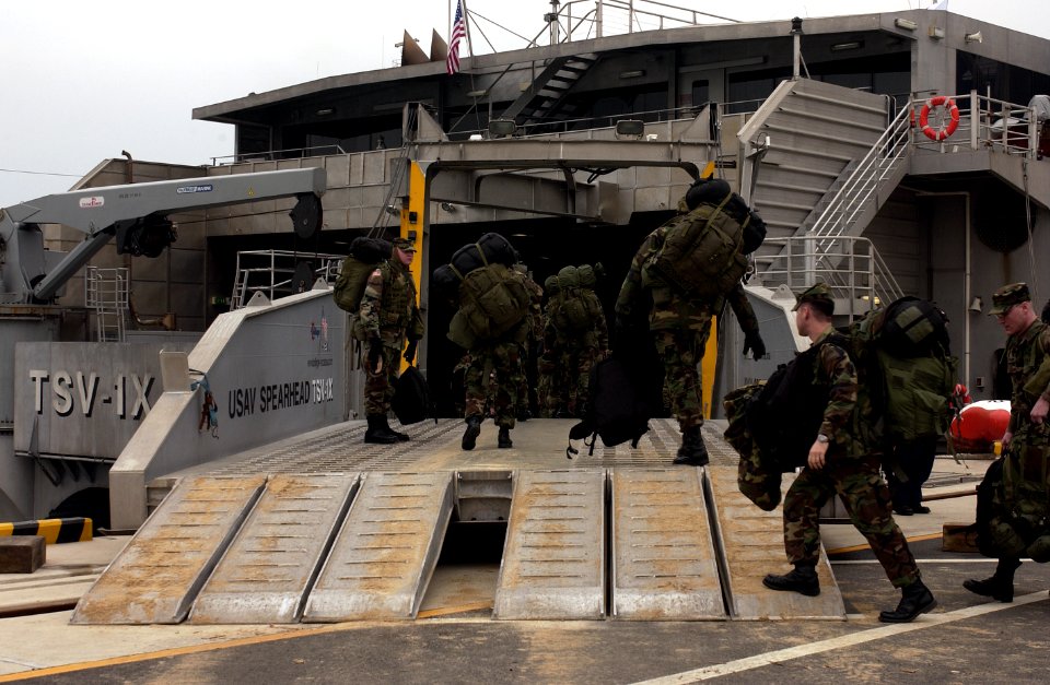 US Navy 050315-F-9629D-183 U.S. Army Soldiers assigned to C Troop, 1st Squadron, 1st U.S. Calvary Regiment, board the U.S. Army's Theater Support Vessel TSV-1X Spearhead