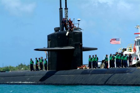 US Navy 050330-N-0962S-070 Sailors man the rails of the fast attack submarine USS Los Angeles (SSN 688) as it pulls into Apra Harbor, Guam, during a scheduled port visit