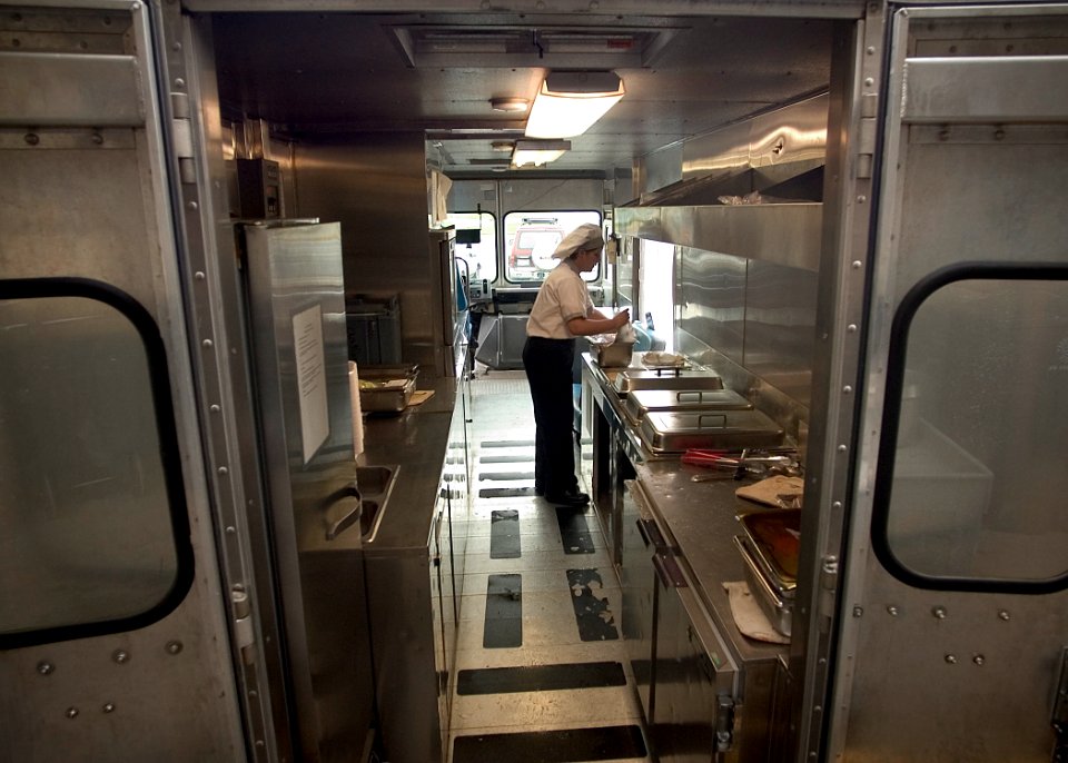 US Navy 050316-N-5134J-001 Culinary Specialist Seaman Jessica Crisp of Murrieta, Calif., prepares the galley's Chuckwagon with fresh cooked lunches