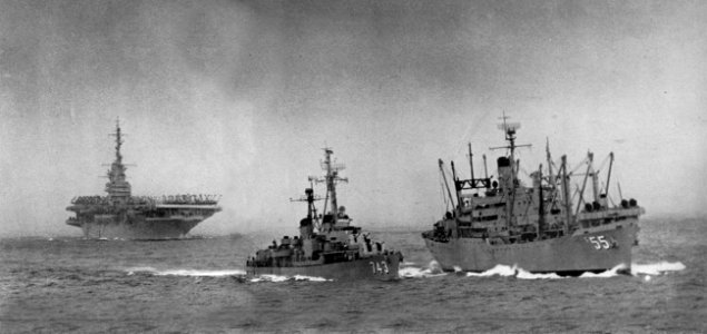 USS Aludra (AF-55) underway with USS Southerland (DD-743) and USS Yorktown (CV-10) off Formosa, in 1954