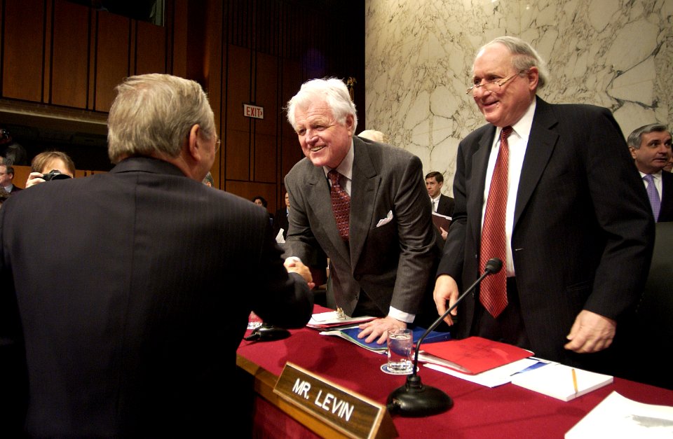 US Navy 050217-F-7203T-022 Secretary of Defense Donald H. Rumsfeld, meets with U.S. Sen. Edward Kennedy (D-MA), center, and Sen. Carl Levin (D-MI) prior to the start of the Senate Armed Services Committee hearing in the Hart Se