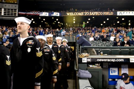 US Navy 050405-N-6477M-278 Sailors assigned to various commands throughout the Northwest Region prepare to take the field to be honored during the Boeing Salute to Armed Forces Night at SAFCO Field, Seattle Wash