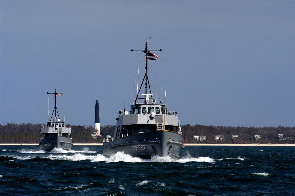US Navy 050321-N-5328N-002 Two yard-patrol boats, YP702 and YP696, depart Naval Air Station (NAS) Pensacola, Fla., for the last time to join the fleet of yard patrol boats at the Naval Academy at Annapolis, Md
