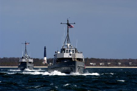 US Navy 050321-N-5328N-002 Two yard-patrol boats, YP702 and YP696, depart Naval Air Station (NAS) Pensacola, Fla., for the last time to join the fleet of yard patrol boats at the Naval Academy at Annapolis, Md