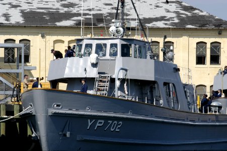 US Navy 050321-N-5328N-001 Crew members aboard yard-patrol boat YP702 make preparations to get the boat underway on board Naval Air Station (NAS) Pensacola, Fla