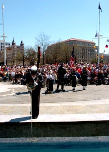 US Navy 050409-N-9693M-342 Seaman Melissa Jefferies, assigned to the U.S. Navy's Ceremonial Guard, decants water into one of four fountains during the 14th annual Blessing of the Fleet ceremony at the Navy Memorial in Washingto