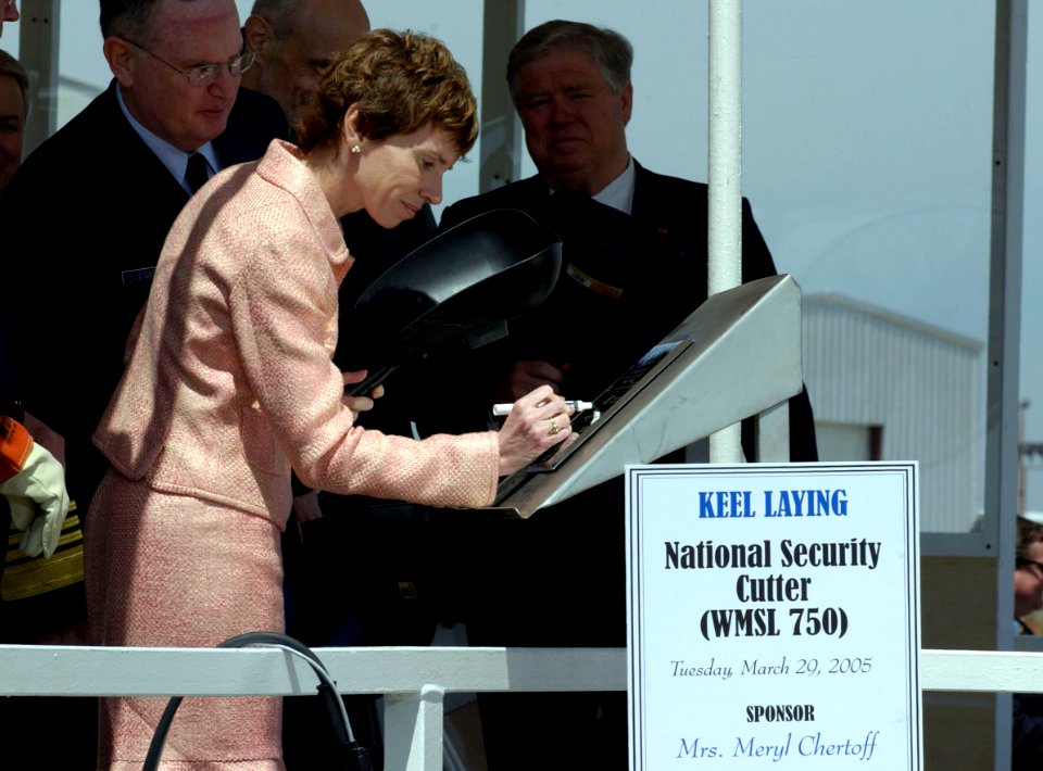 US Navy 050329-C-3550N-089 Meryl Chertoff, ship sponsor and wife of Secretary of Homeland Security Michael Chertoff, initials a placard that will be displayed aboard the U.S. Coast Guard's first National Security Cutter (WMSL 7