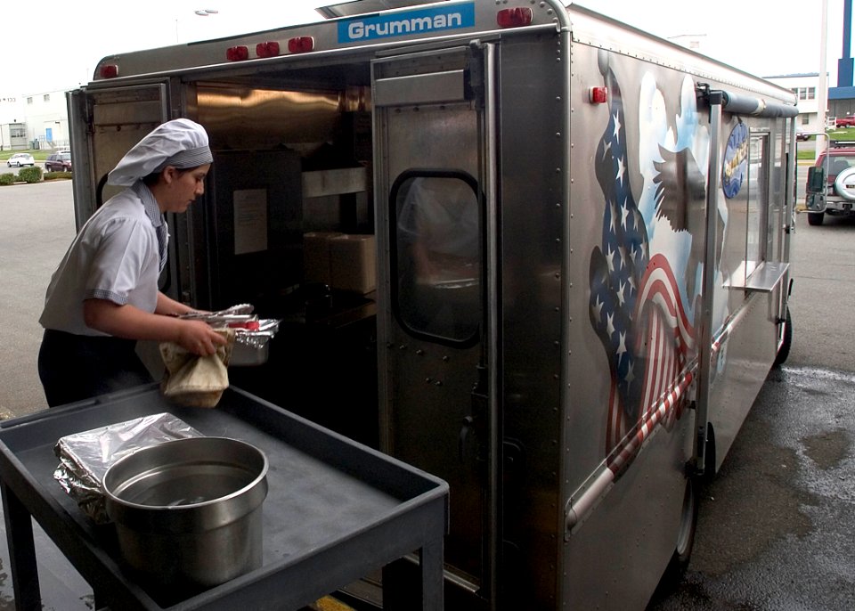 US Navy 050316-N-5134J-004 Culinary Specialist Seaman Jessica Crisp of Murrieta, Calif., prepares the galley's Chuckwagon with fresh cooked lunches