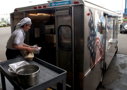 US Navy 050316-N-5134J-004 Culinary Specialist Seaman Jessica Crisp of Murrieta, Calif., prepares the galley's Chuckwagon with fresh cooked lunches