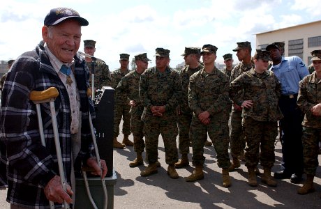 US Navy 050303-N-0000W-001 Retired Navy Lt. John W. Finn, the oldest living recipient of the Medal of Honor, speaks to Marines and Sailors photo