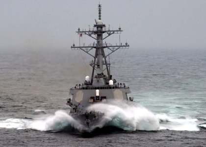 US Navy 050402-N-6363M-027 Waves crash over the bow of the Arleigh-Burke-class guided missile destroyer USS Barry (DDG 52) as she plows through heavy seas while underway in the Mediterranean Sea