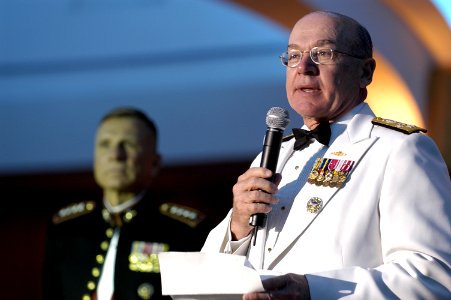 US Navy 050423-N-0295M-022 Commandant of the Marine Corps Gen. Michael Hagee looks on as Chief of Naval Operations Adm. Vern Clark speaks at the Navy-Marine Corps Relief Society Ball of 2005