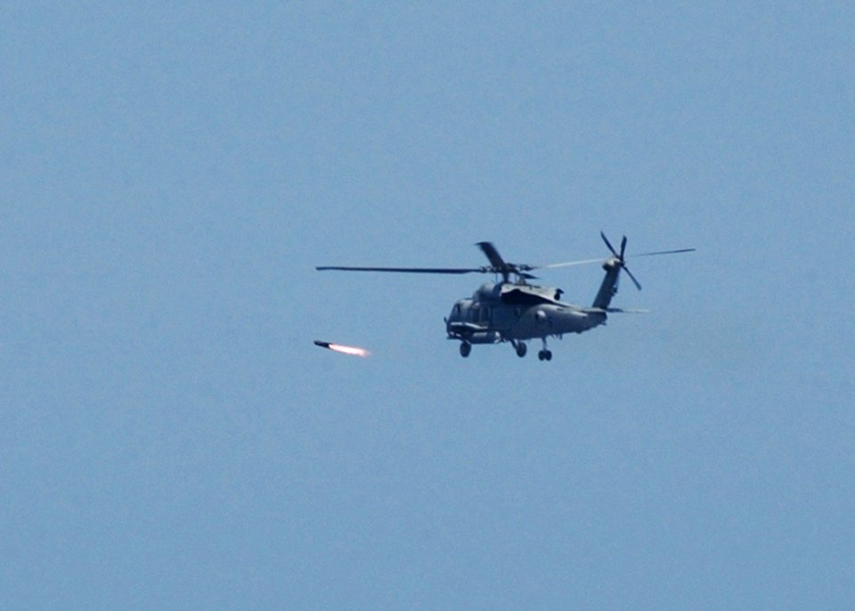 US Navy 050427-N-7512V-005 An HH-60H Seahawk helicopterfires an AGM-114B Hellfire missile at a weapons training site