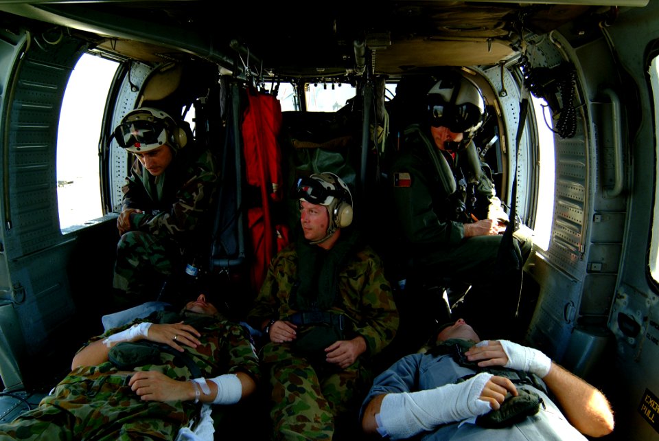 US Navy 050405-N-0357S-009 Air crewman aboard an U.S. Navy MH-60S Seahawk helicopter, makes final preparations for take-off as they monitor their patients