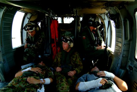 US Navy 050405-N-0357S-009 Air crewman aboard an U.S. Navy MH-60S Seahawk helicopter, makes final preparations for take-off as they monitor their patients