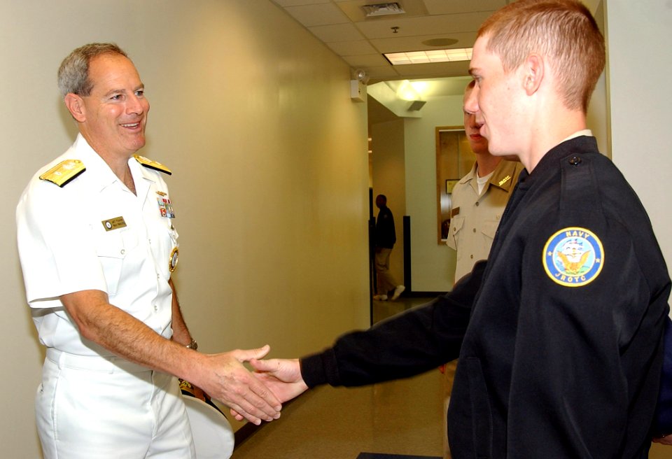 US Navy 050426-N-4729H-022 Commander, Navy Recruiting Command, Rear Adm. Jeffrey Fowler, greets a student at the Delaware Military Academy