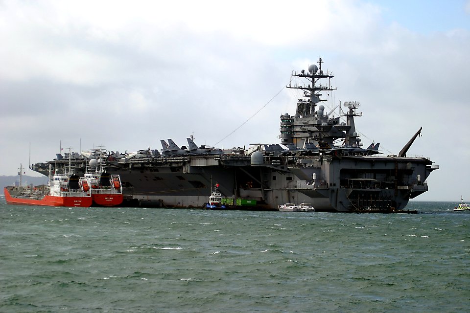 US Navy 050406-N-0000J-001 The Nimitz-class aircraft carrier USS Harry S. Truman (CVN 75) sits at anchor in Stokes Bay on the south coast of England during a scheduled port visit