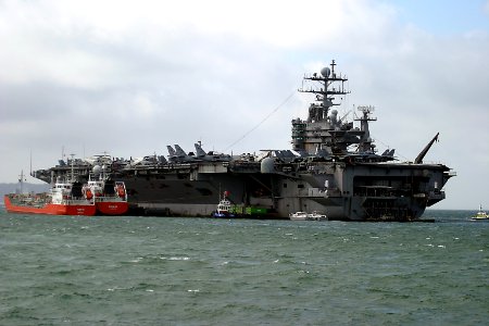 US Navy 050406-N-0000J-001 The Nimitz-class aircraft carrier USS Harry S. Truman (CVN 75) sits at anchor in Stokes Bay on the south coast of England during a scheduled port visit