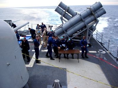 US Navy 050429-N-0000X-002 Sailors aboard the guided missile cruiser USS Normandy (CG 60) prepare to receive survivors rescued from the Gulf of Aden after their small vessel capsized 25 miles off the coast of Somalia