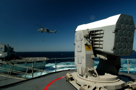 US Navy 050313-N-8704K-002 An SH-60B Seahawk delivers a pallet of ordnance to the Military Sealift Command (MSC) fast combat support ship USNS Supply (T-A0E 6) during a ammunition and ordnance off-load with USS John F. Kennedy
